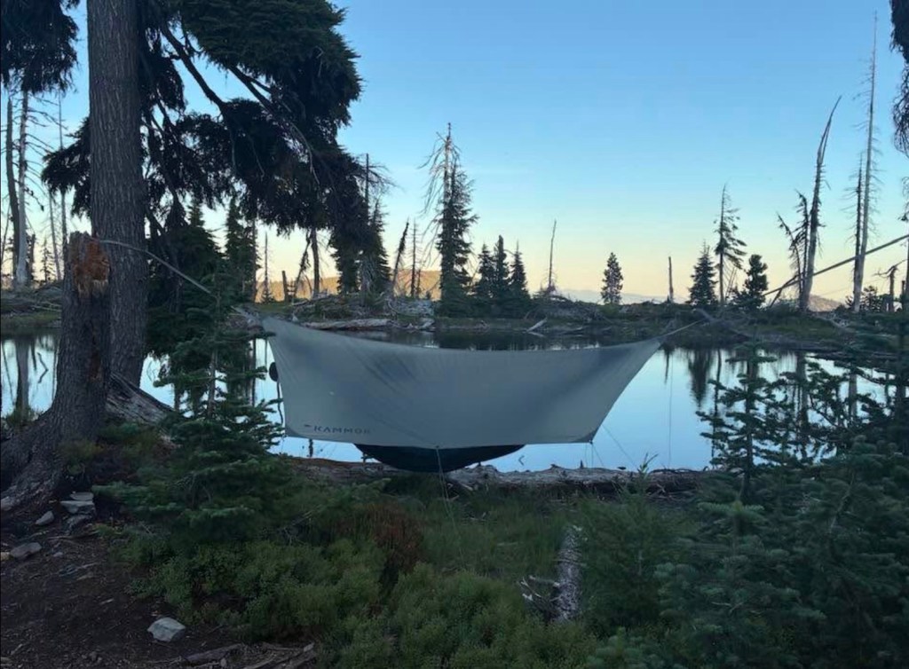 Picture a hammock with a small lake in the background
